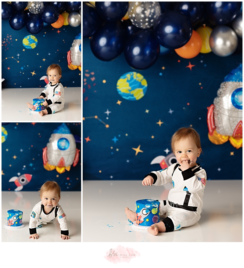Calgary space themed cake smash astronaut boy cake in mouth