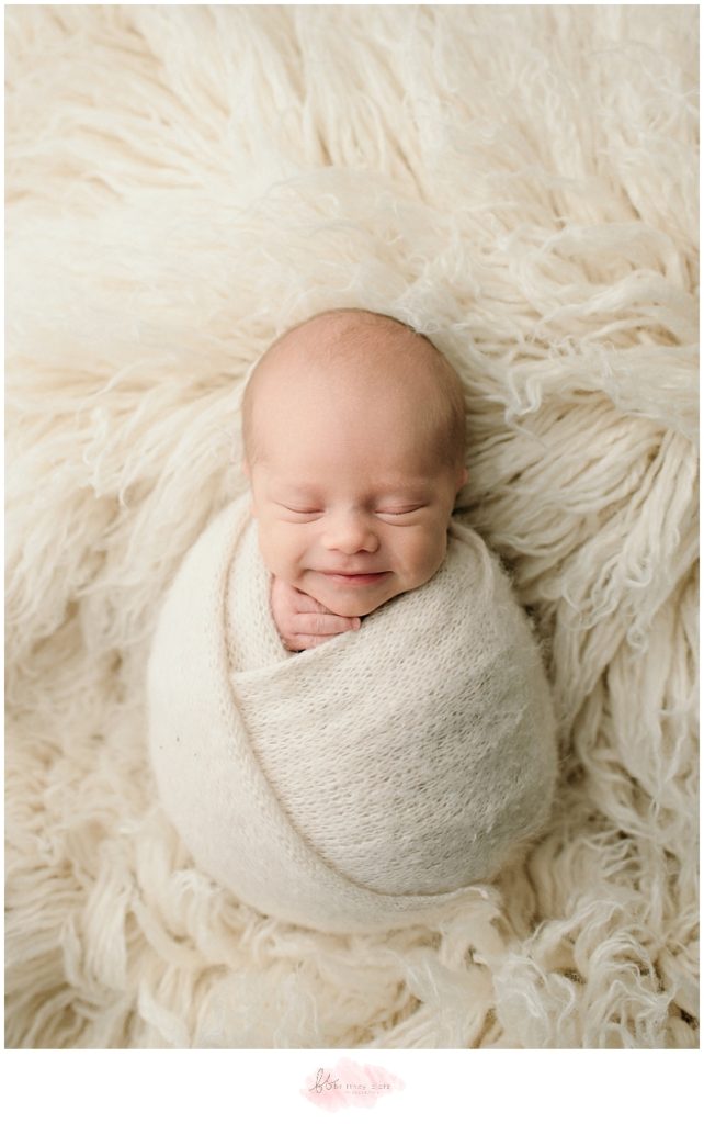 Calgary newborn photographer baby boy smile