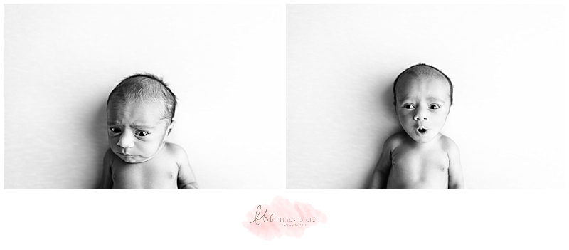 Black and white photo of baby boy looking at camera 