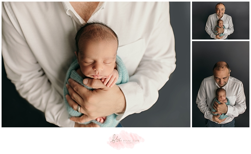 baby boy in dad's hands