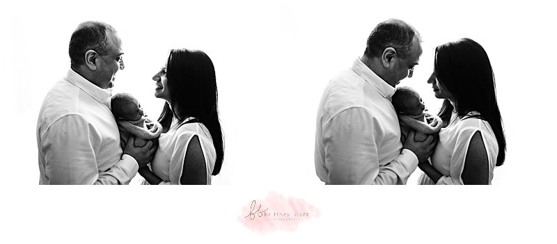 backlit images of parents holding baby boy