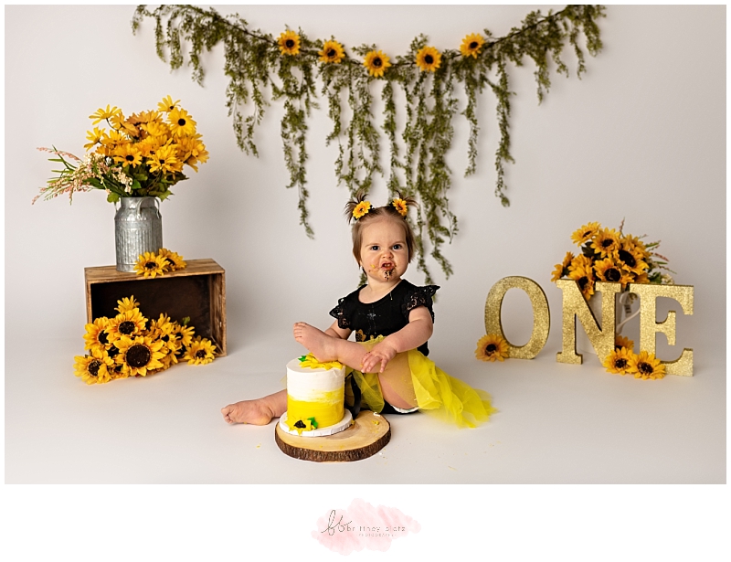 Calgary sunflower cake smash foot on top of cake