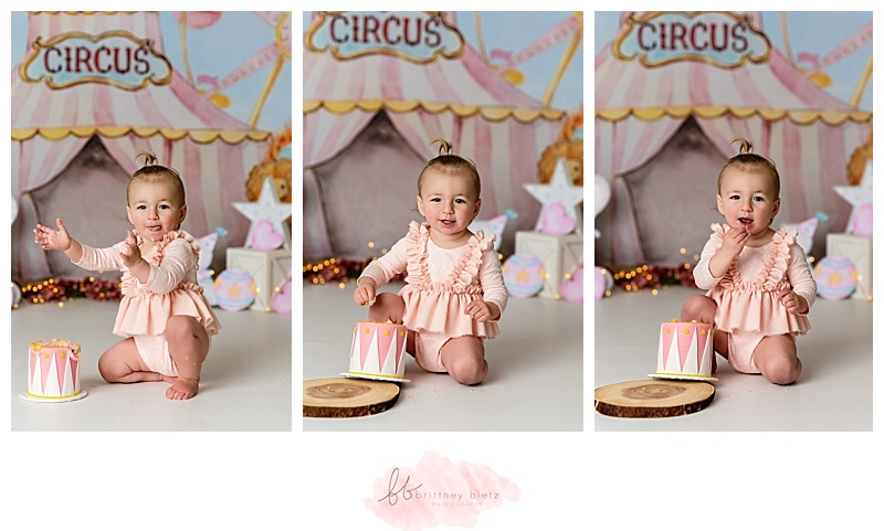 Baby girl enjoying her carnival-themed cake in Calgary