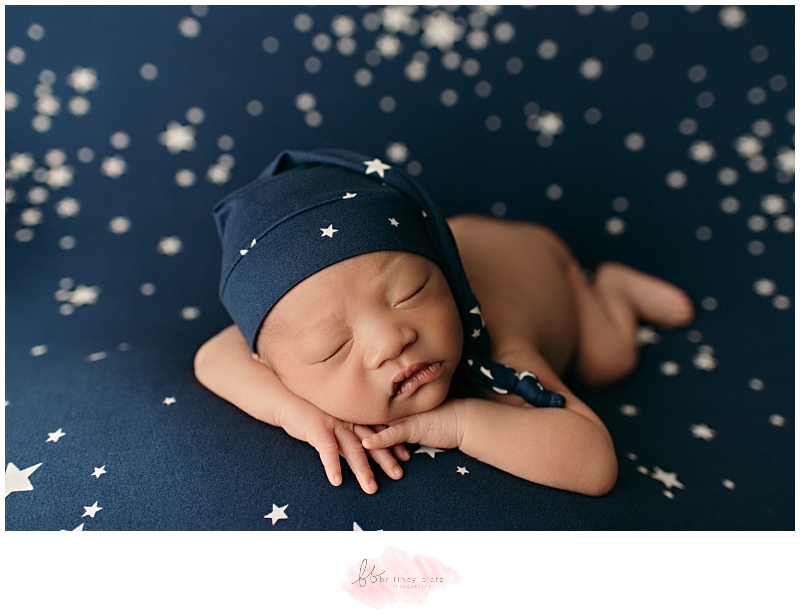 Baby boy forward facing with blue star sleepy cap