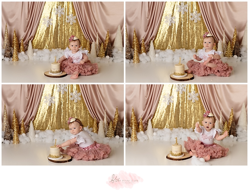 Calgary winter-themed cake smash baby girl eating cake in pink tutu