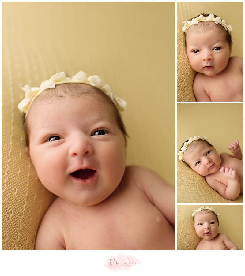 Calgary Newborn Photographer baby girl on yellow wide awake open eyes