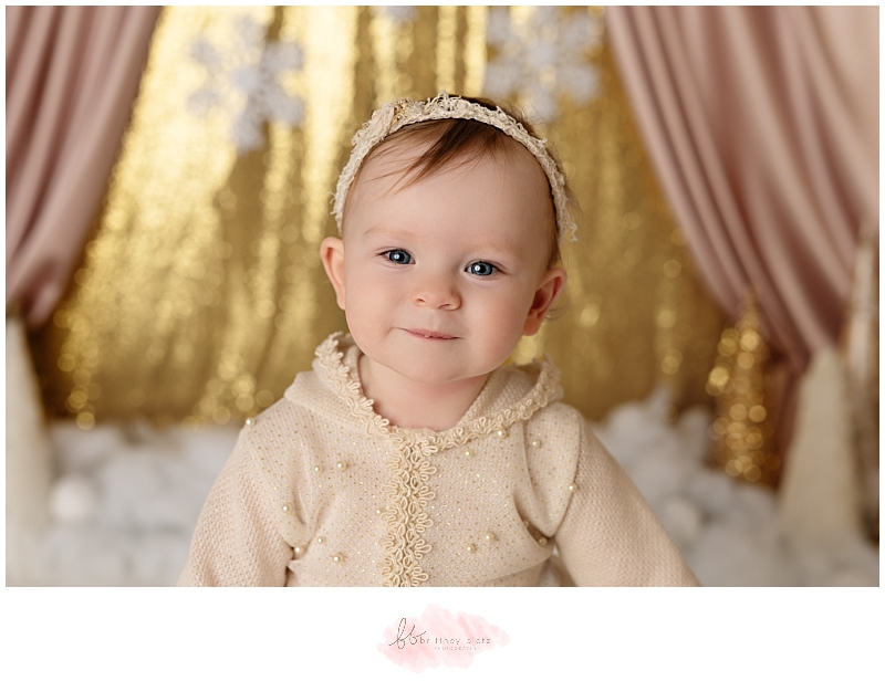 Calgary winter-themed cake smash, close up of baby girl smiling