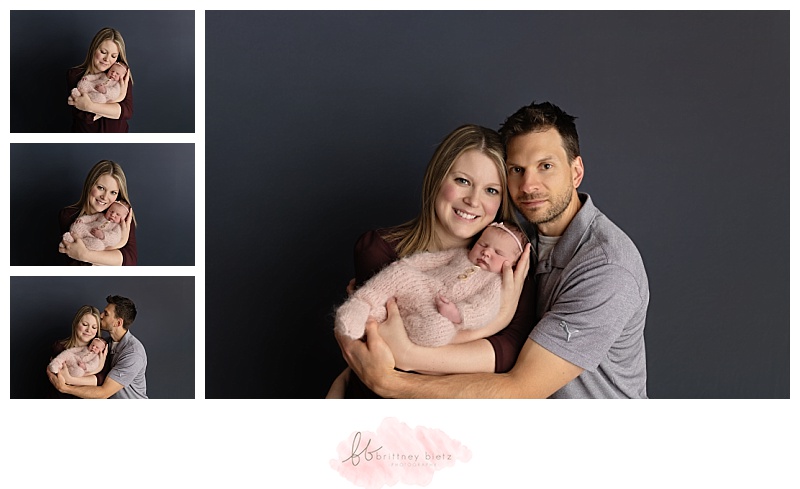 Mom and dad posing with newborn baby girl