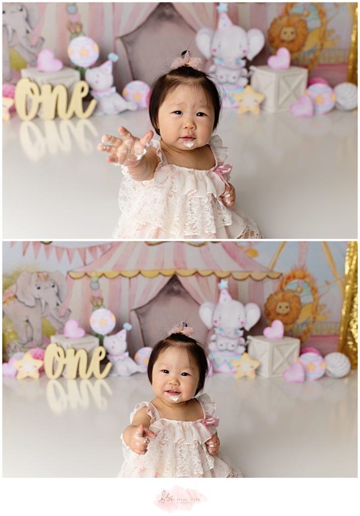 Girly circus themed cake smash with girl smiling and cake on face