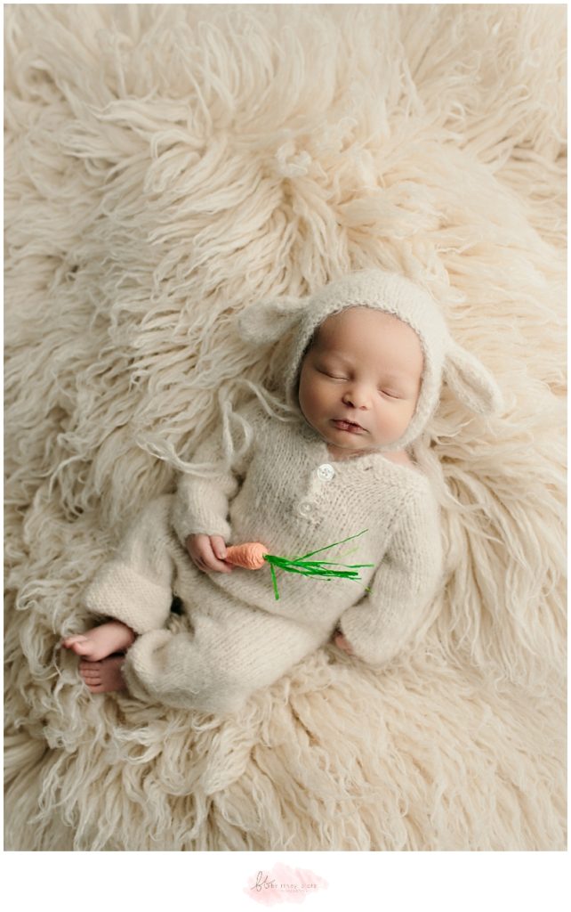 Baby boy in mohair romper and lamb bonnet
