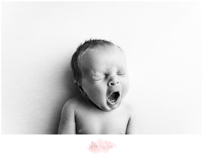 black and white newborn portrait of yawn