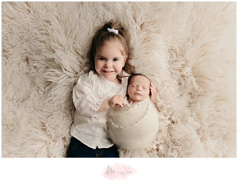 Sibling during a newborn photo session in Calgary