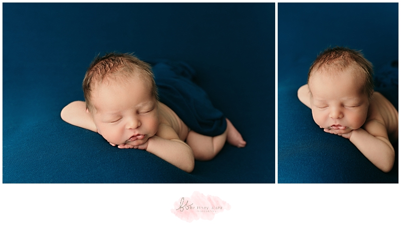 Calgary newborn baby boy forward facing sleeping on blue fabric